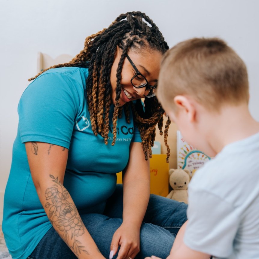 A McHur Care specialist helping a young boy