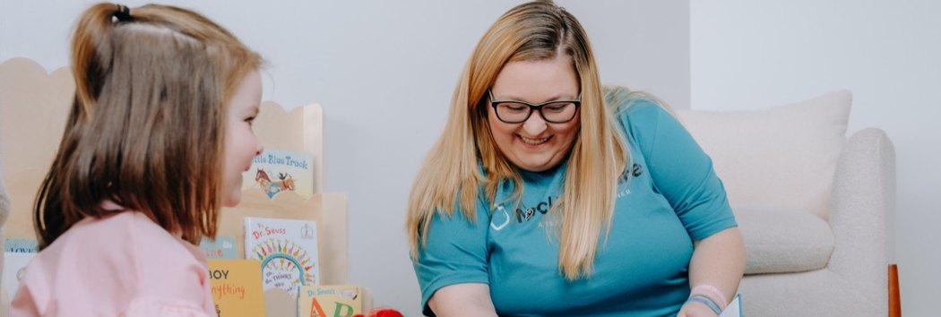 A McHur Care specialist working one-on-one with a child