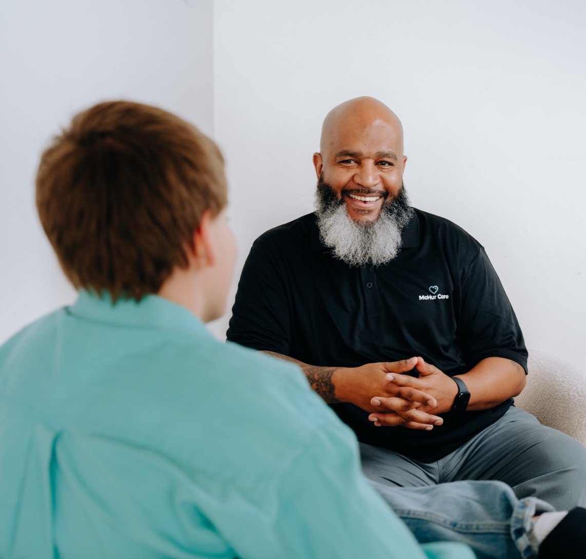 A McHur Care specialist talking with a client